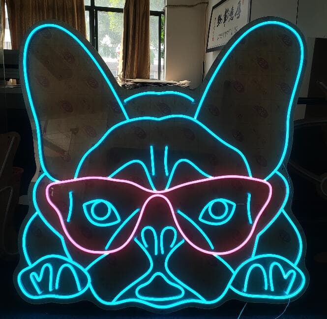 Blue French bulldog neon sign wearing pink cat-eye glasses